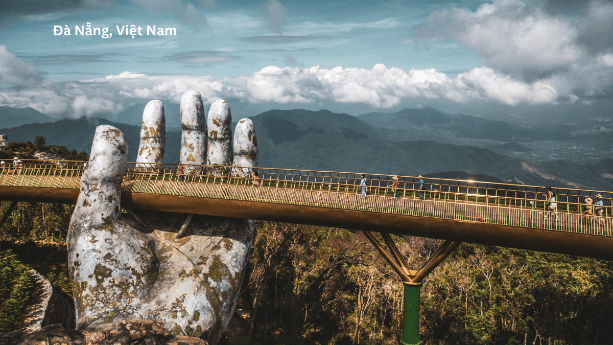 Da Nang Vietnam Golden Bridge held by giant stone hands on Ba Na Hills